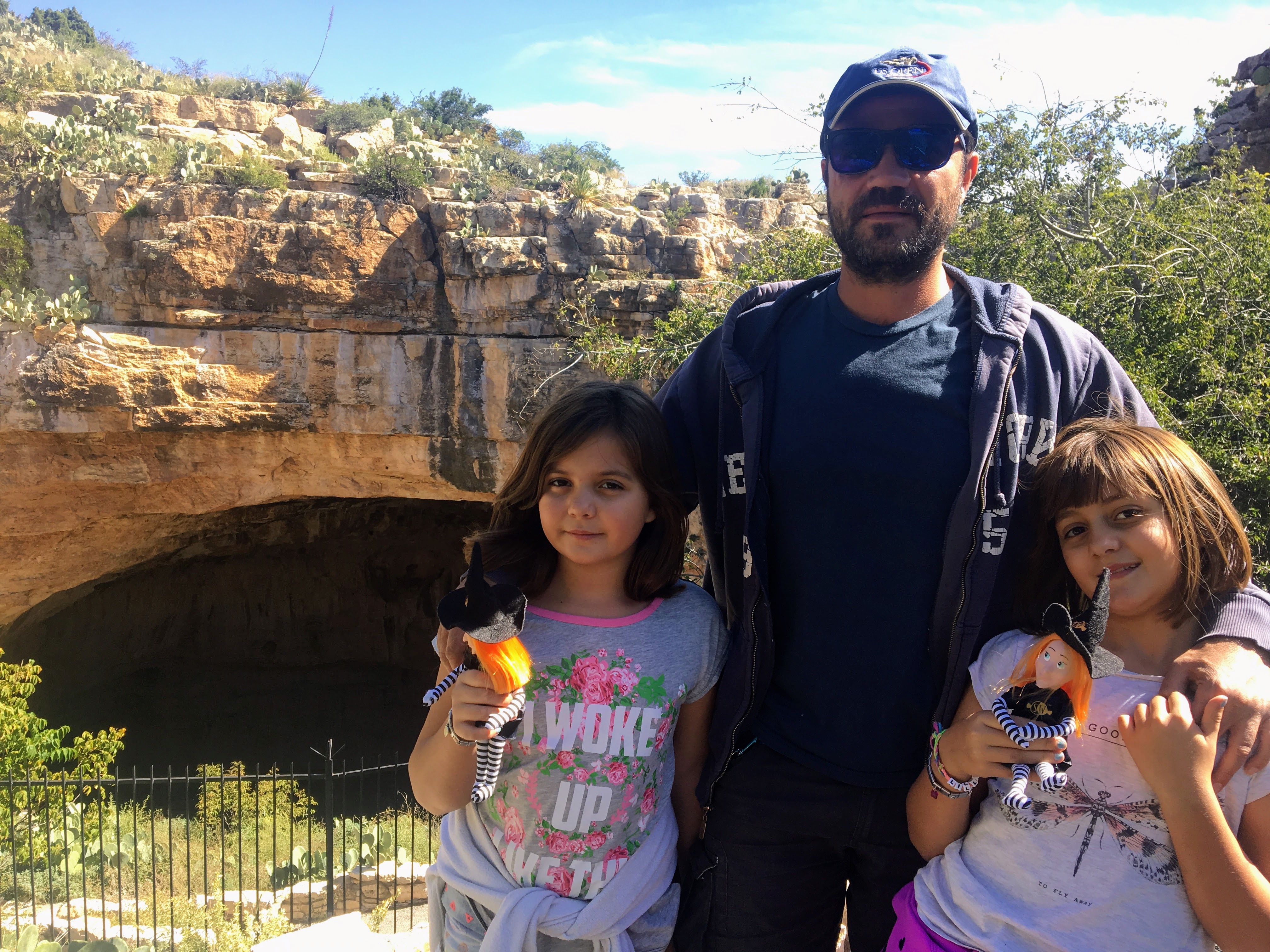 Dad and the girls at the cave entrance